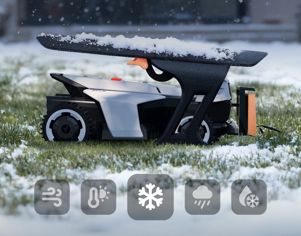 Navimow i105E Mähroboter steht bei Schneefall geschützt unter seiner Garage.